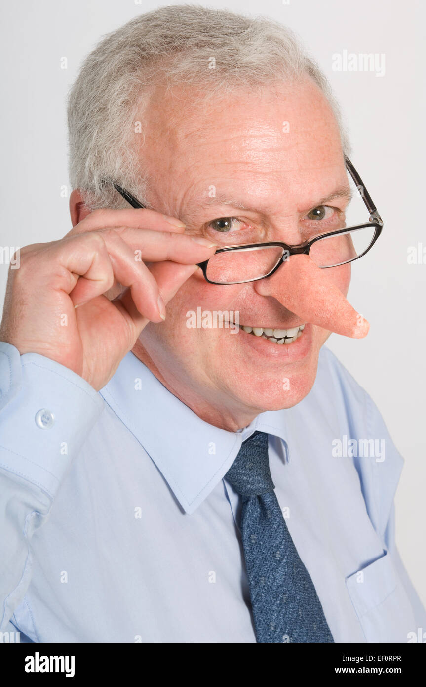 Businessman with a very long nose Stock Photo