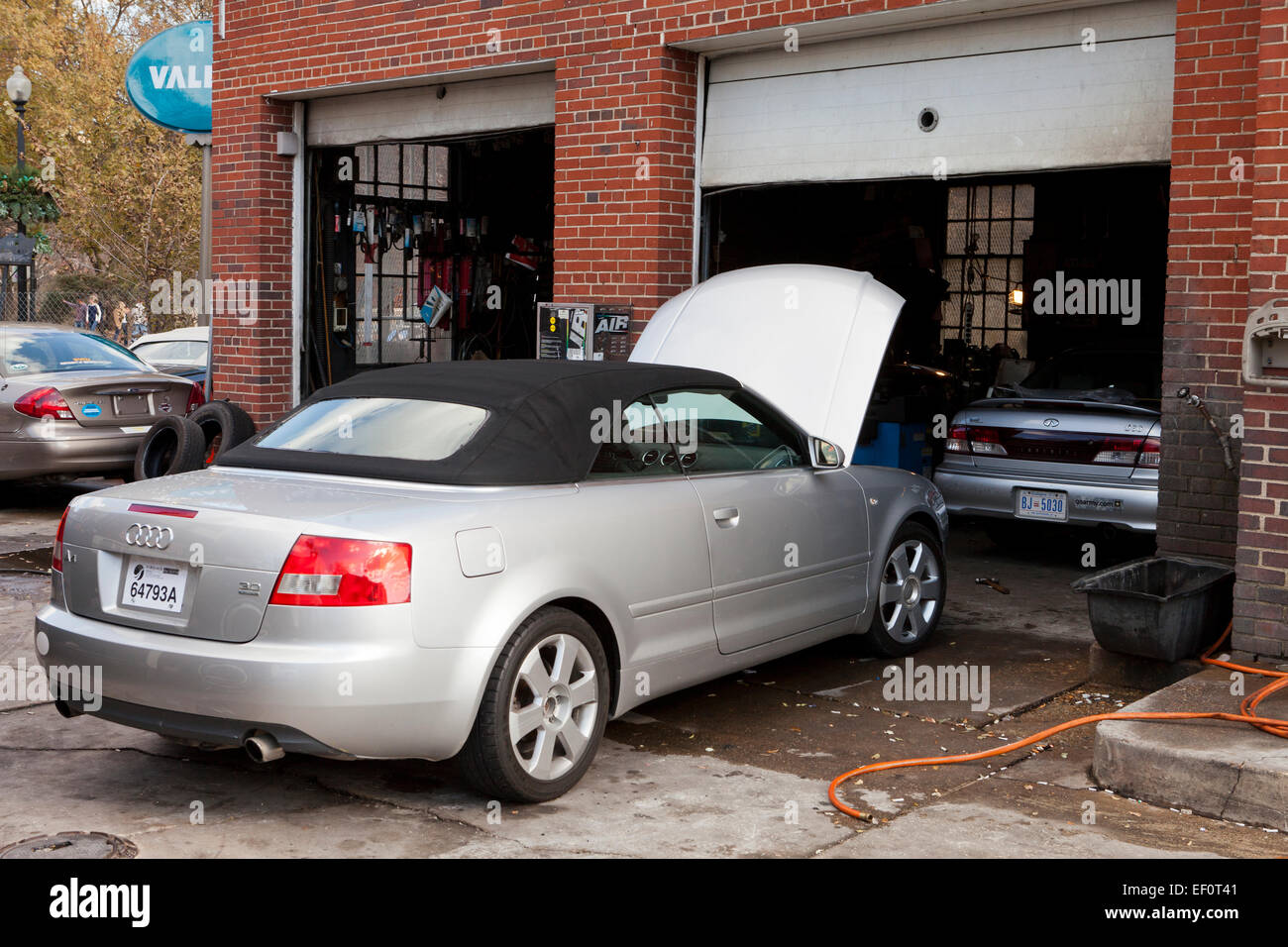 Audi A4 parked in front of auto service garage - USA Stock Photo