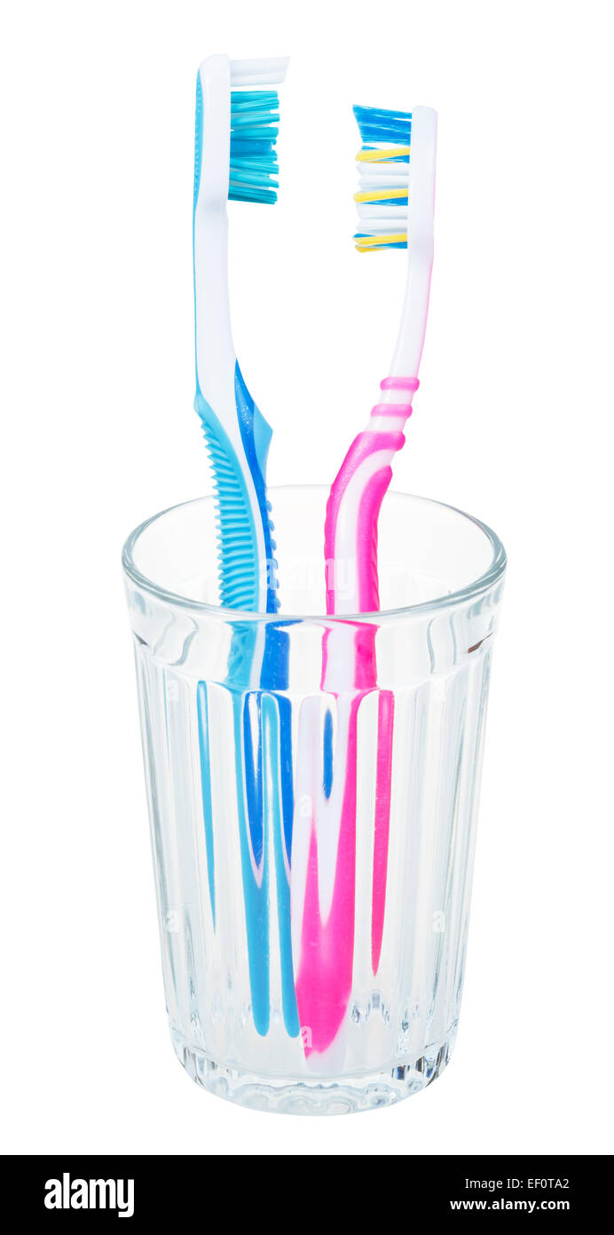 pair tooth brushes in glass - family set of toothbrushes isolated on ...