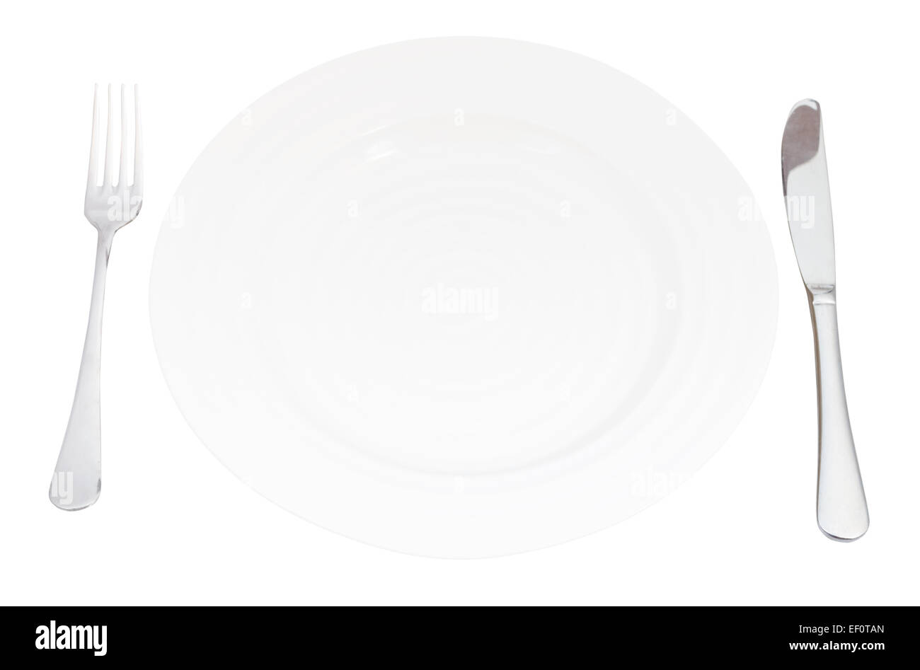 empty white plate with fork and knife set isolated on white background ...