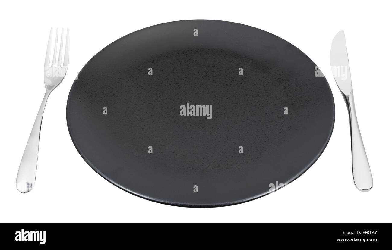 empty black plate with fork and knife set isolated on white background ...