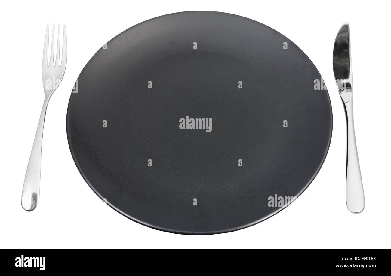 empty black plate with fork and knife set isolated on white background ...