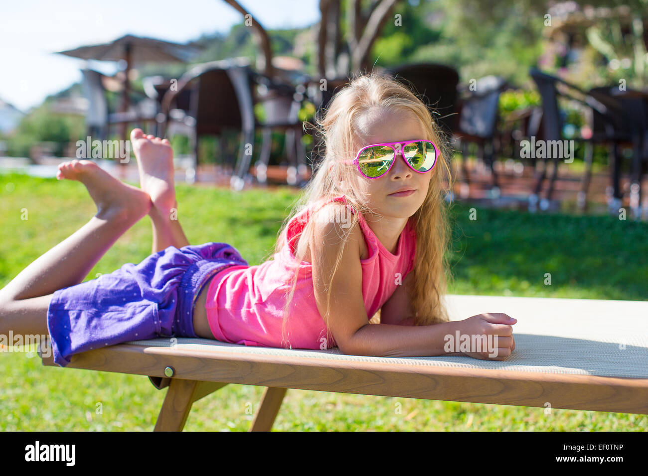 Portrait of adorable little girl outdoors Stock Photo - Alamy