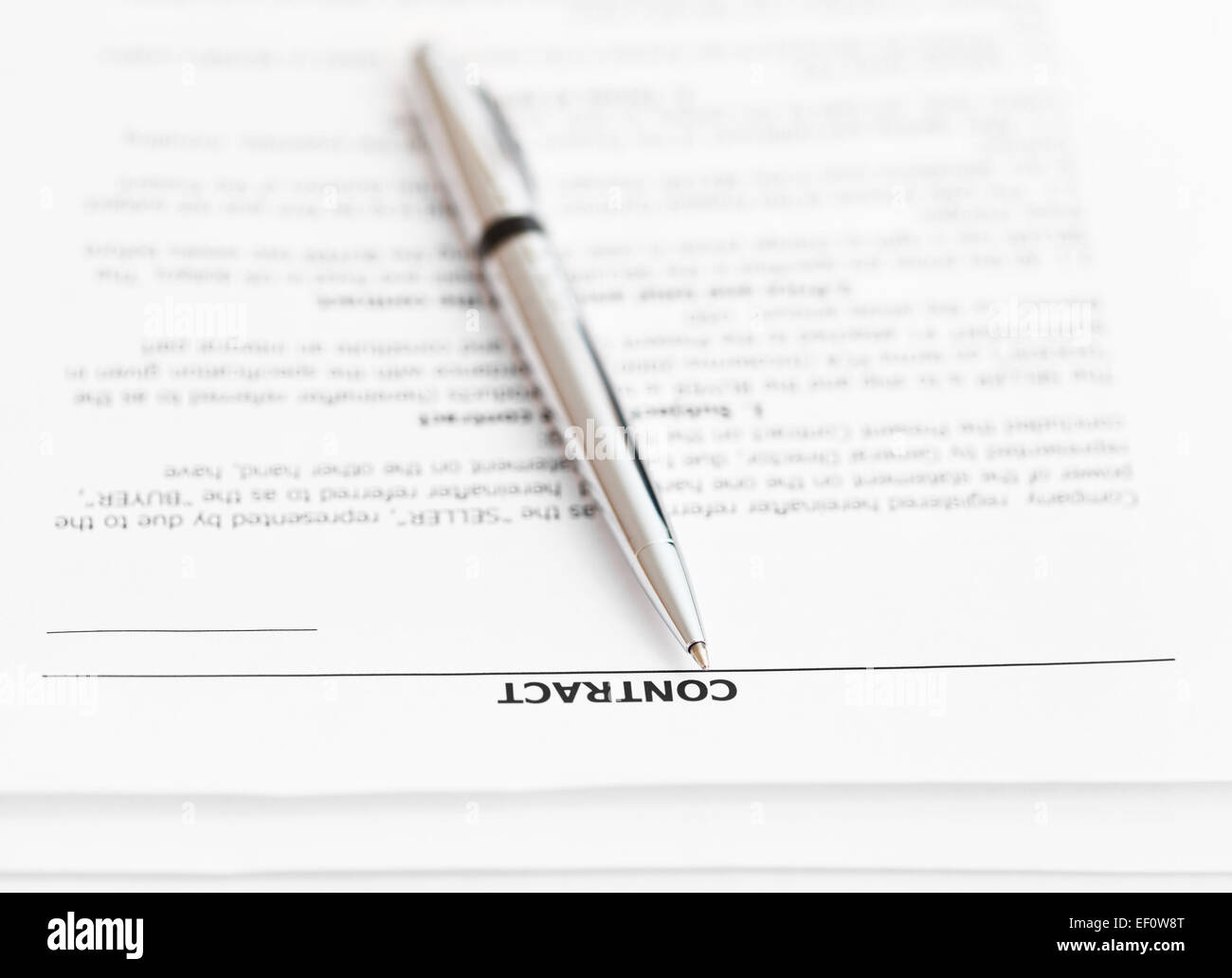 pages of sales contract and silver pen close up Stock Photo