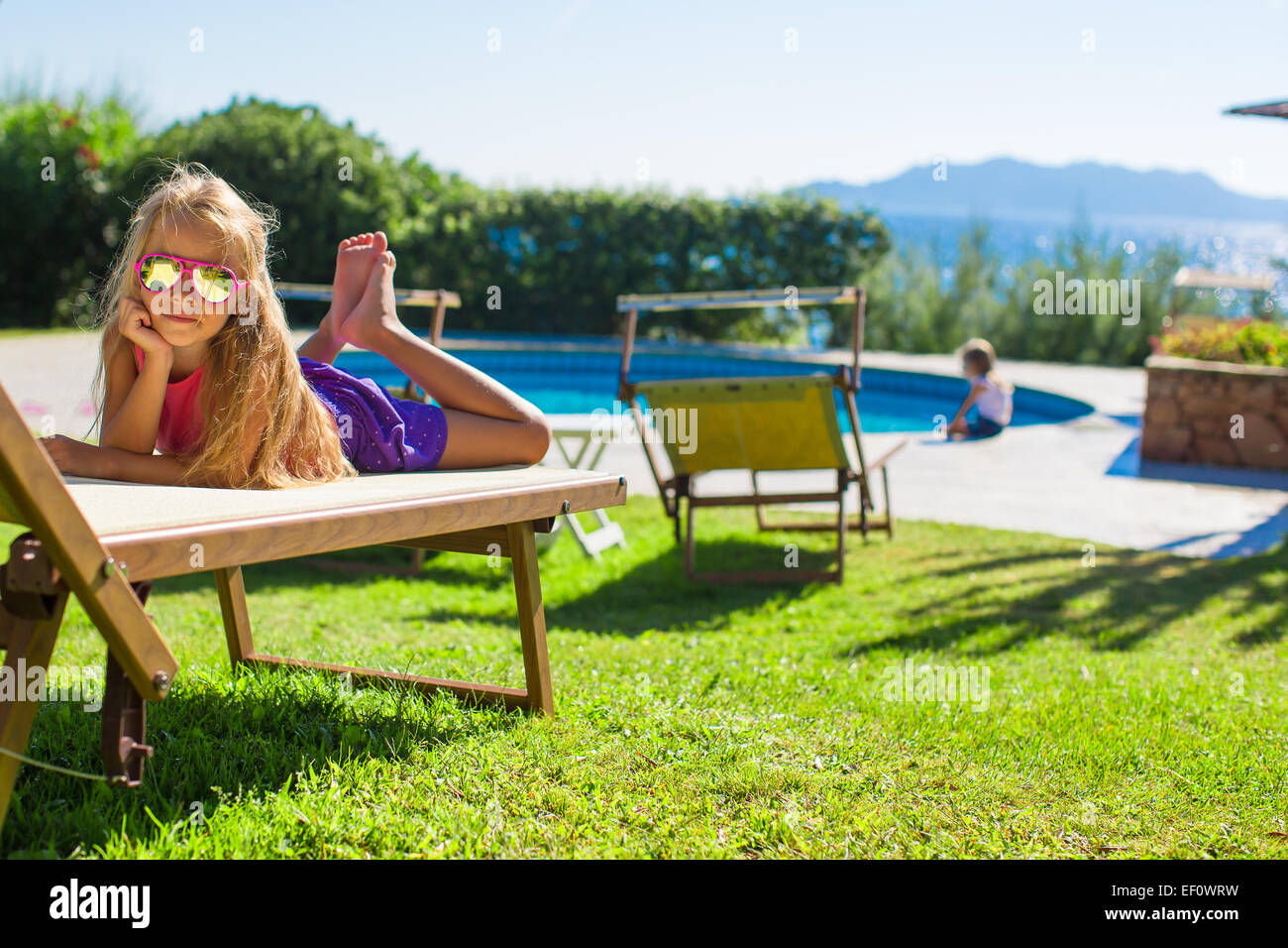 Portrait of adorable little girl outdoors Stock Photo - Alamy