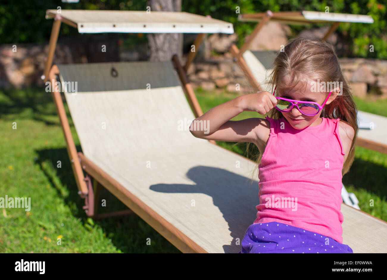 Portrait of adorable happy little girl outdoors Stock Photo - Alamy