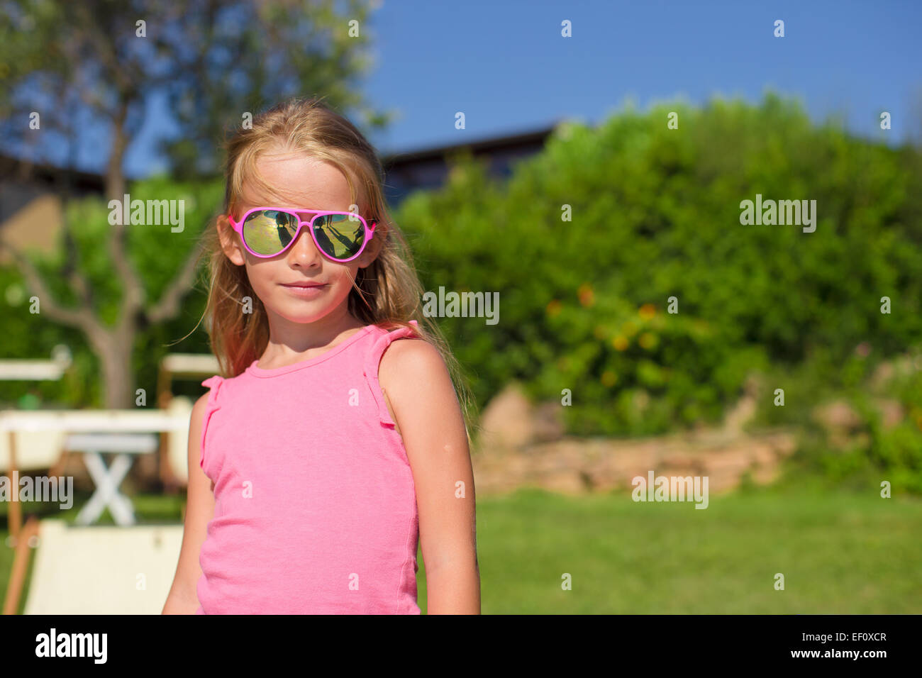 Portrait of adorable little girl outdoors Stock Photo - Alamy