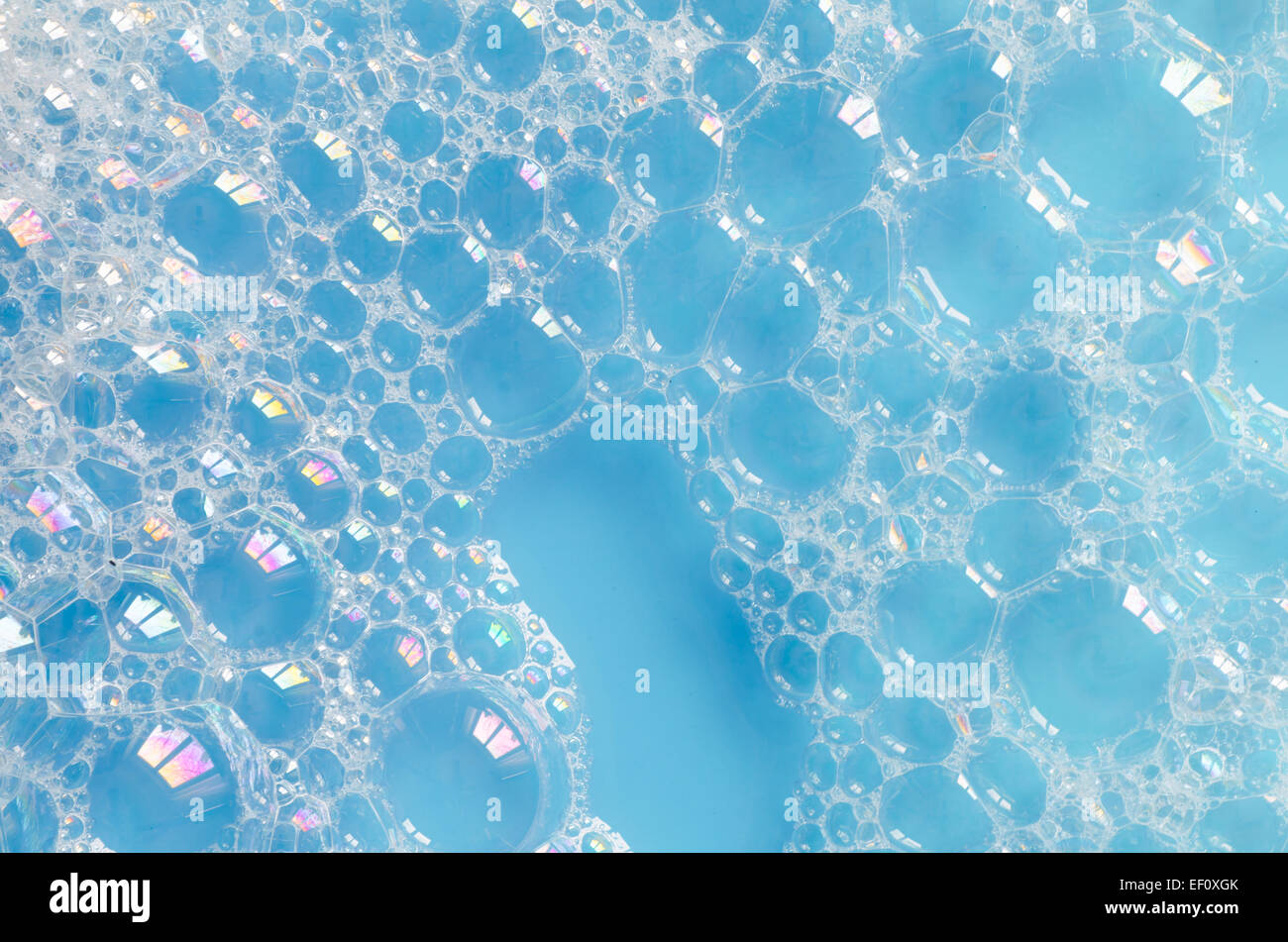 foam bubbles on blue water background Stock Photo - Alamy