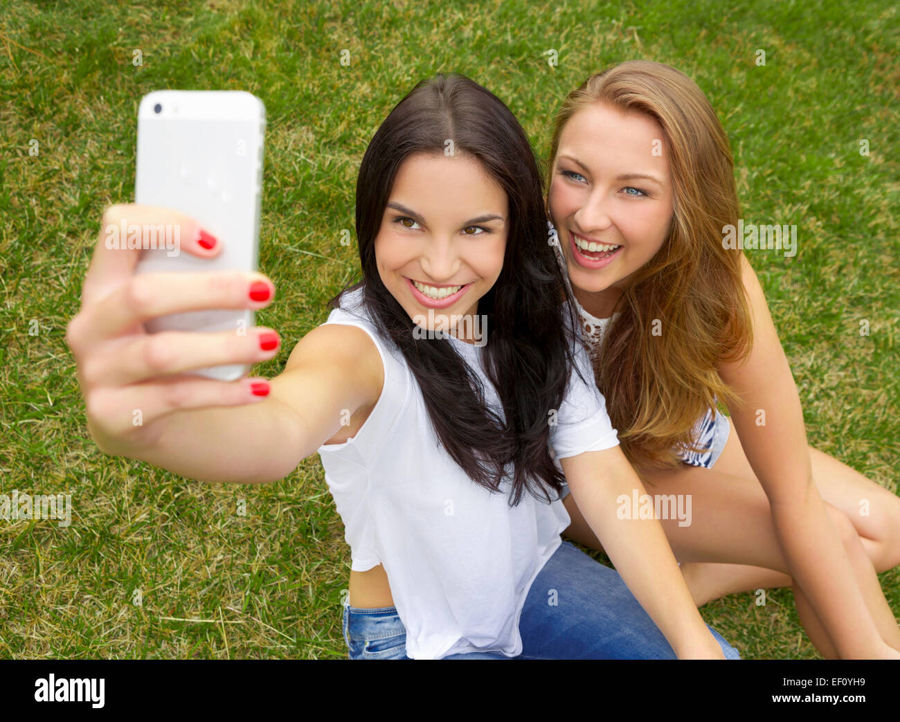 Beautiful and happy teenagers taking selfies Stock Photo