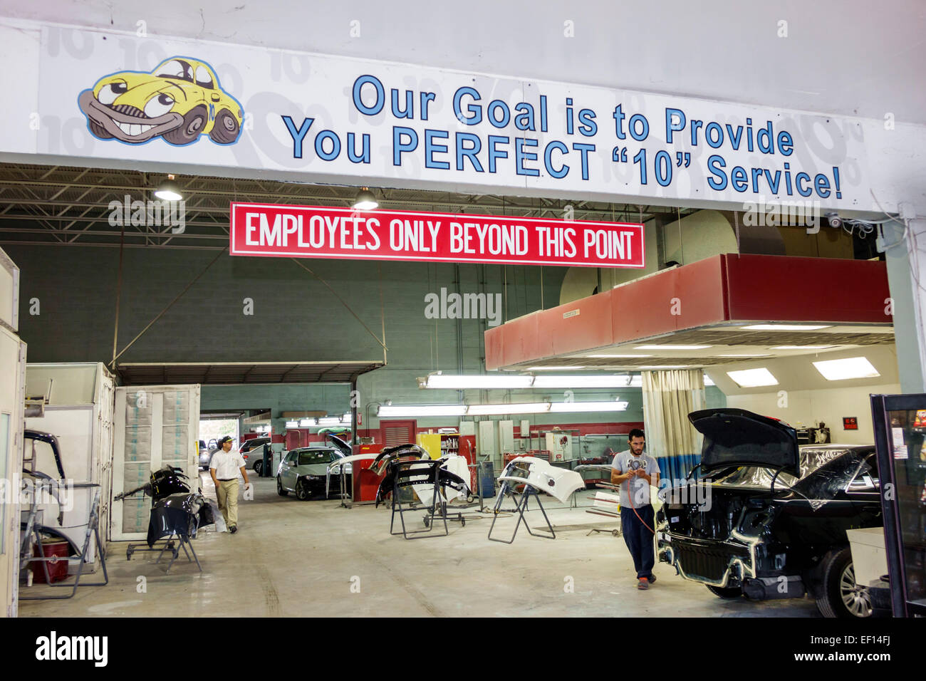 Miami Florida,automobile vehicle collision center,centre,body work,repair,damage,sign,logo,employees only this point,visitors travel traveling tour to Stock Photo