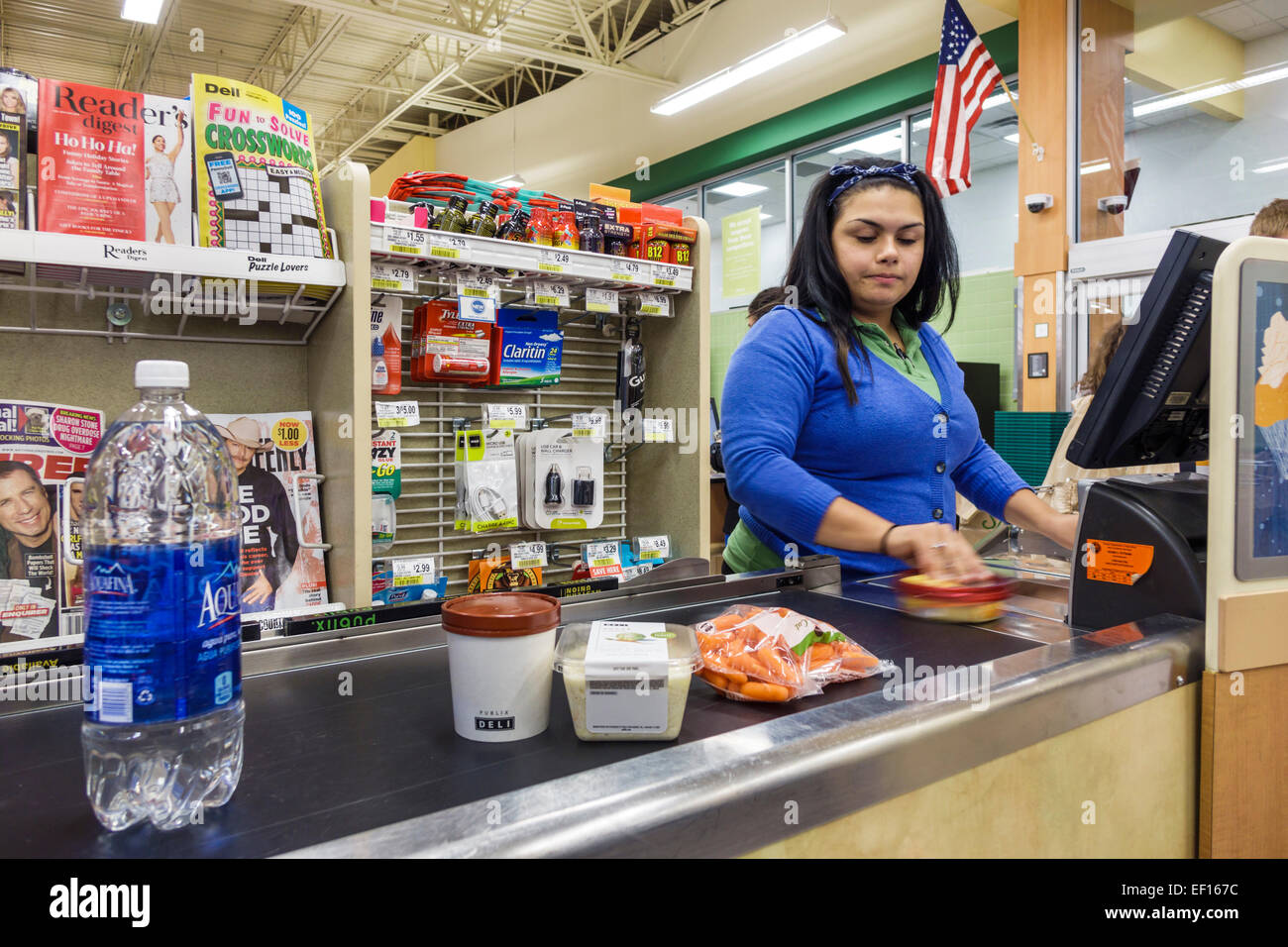 Orlando Florida,Publix,grocery store,supermarket,food,sale,check out line,queue,cashier,Hispanic woman female women,employee employees worker workers Stock Photo