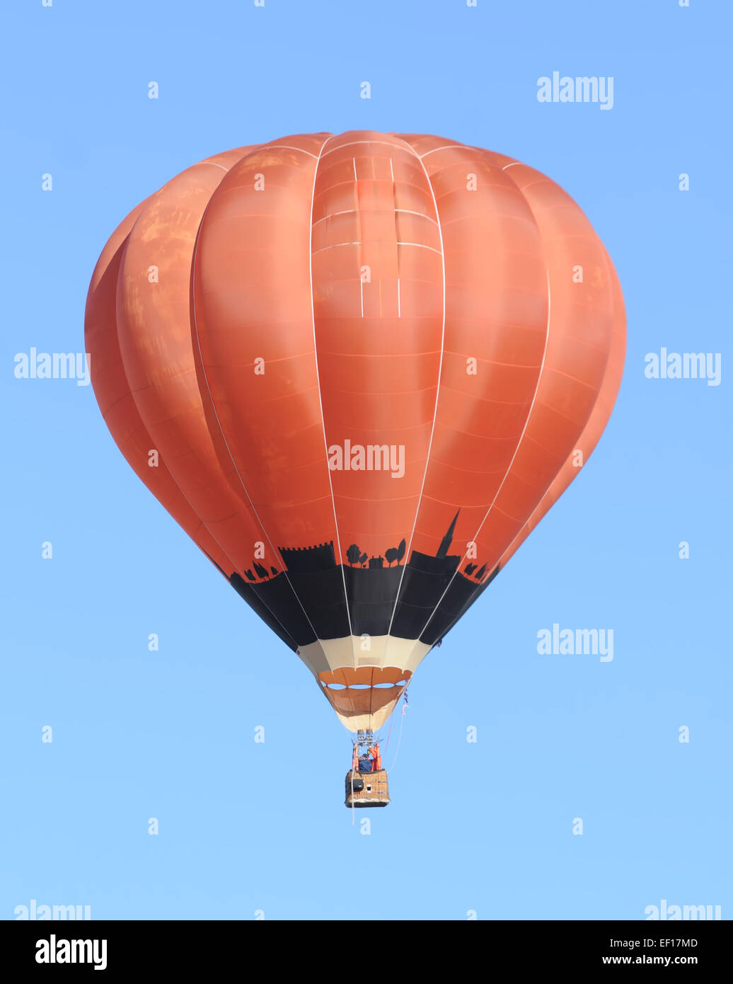 Bright red hot air balloon against blue sky Stock Photo