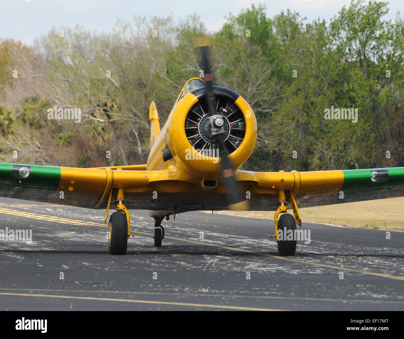 Yellow propeller airplane on the ground approaching Stock Photo Alamy