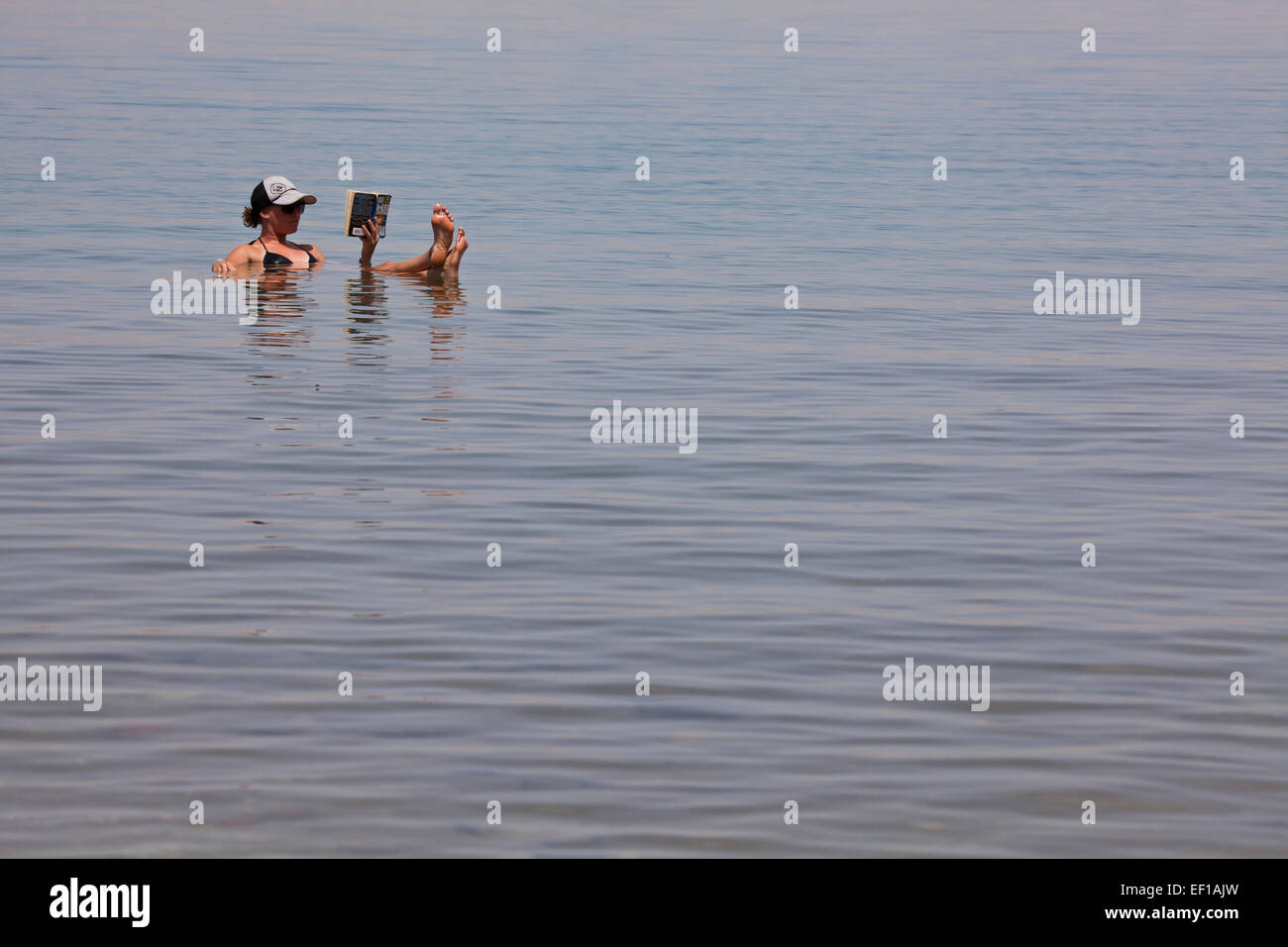 Relaxing in the dead sea. Stock Photo