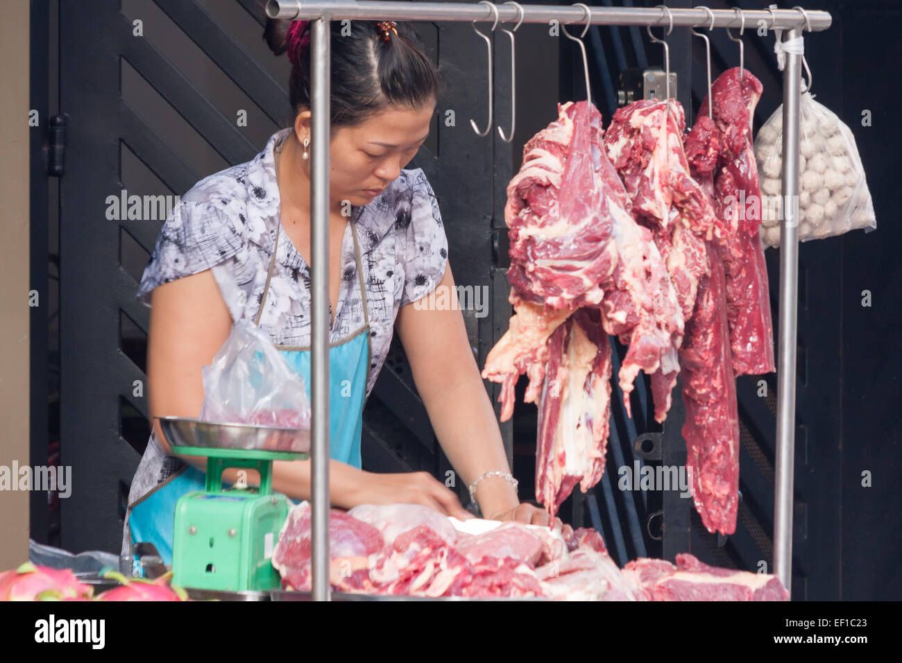 woman street market vendor Ho Chi Minh City Saigon Vietnam Stock Photo