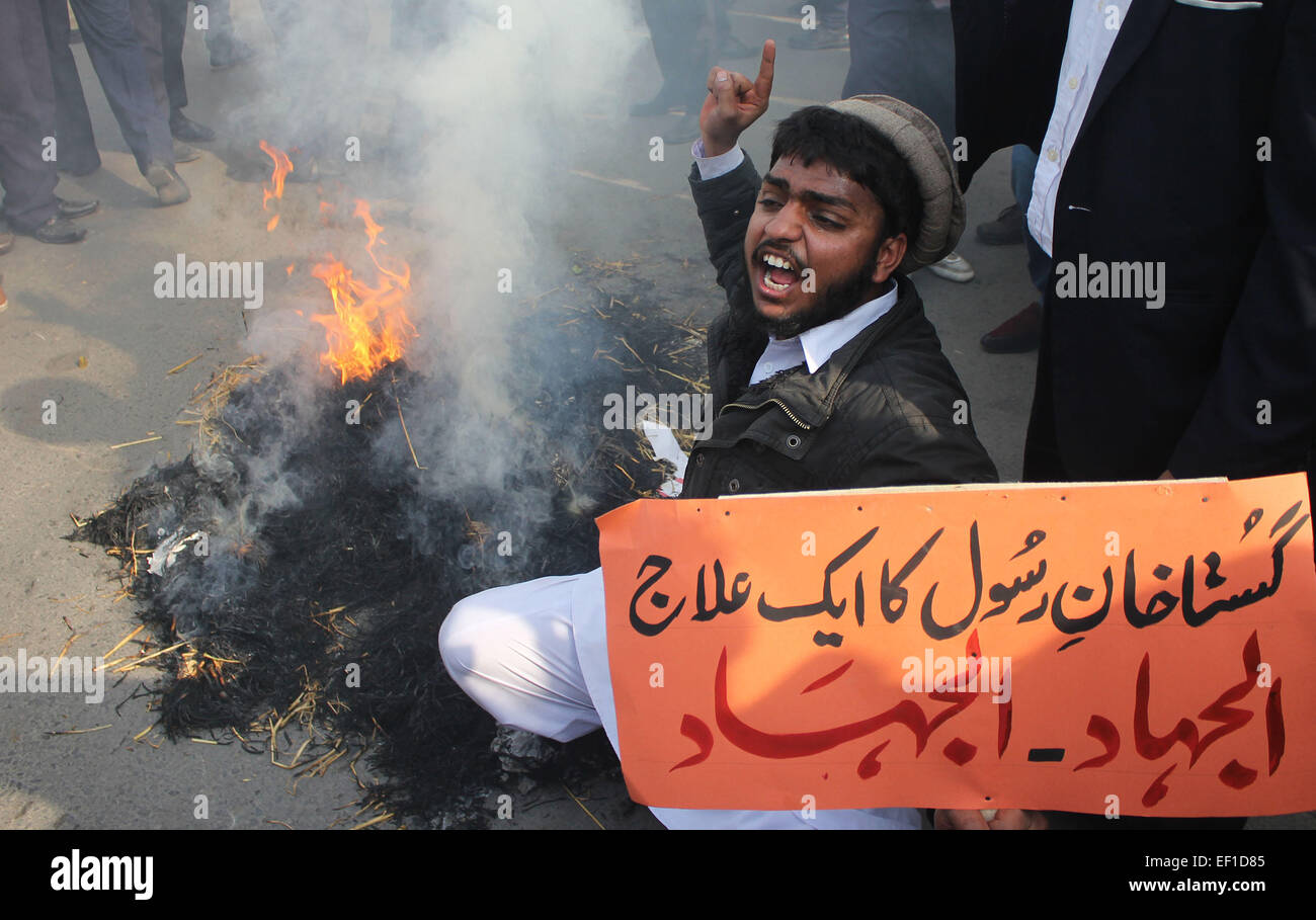 Pakistani students of (Punjab Polytechnic Institute ) burn an effigy of French cartoonists during a protest against publications of blasphemous caricatures in French magazine 'Charlie Hebdo' and showing their hearty devotion to Holy Prophet Muhammad (PBUH) during protest demonstration. Tens of thousands across Afghanistan, Pakistan and Muslim-majority Indian Kashmir took to the streets for southern Asia's biggest protests against satirical magazine Charlie Hebdo's cartoon portrayal of the Prophet Mohammed. © Rana Sajid Hussain/Pacific Press/Alamy Live News Stock Photo