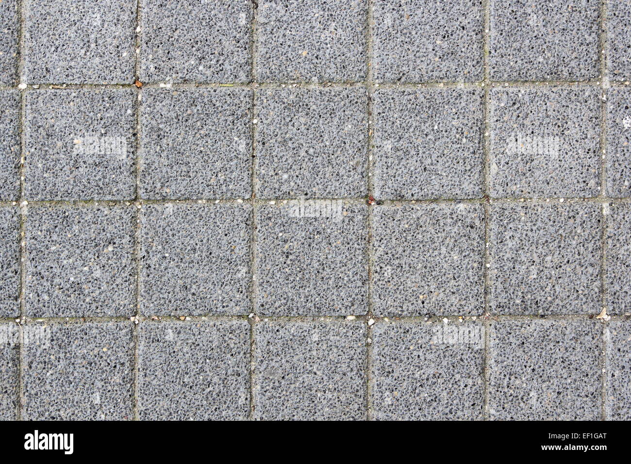 grey asphalt tiles texture on urban pedestrian path Stock Photo