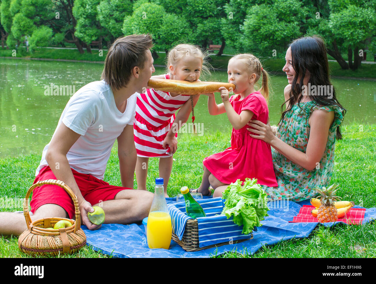 Happy family picnicking in the park and have fun Stock Photo - Alamy