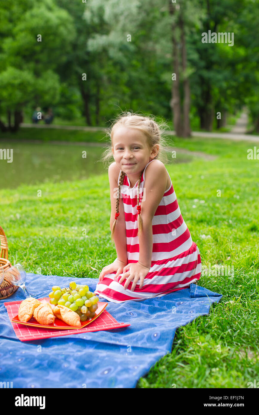 Adorable little girl on picnic outdoor near the lake Stock Photo - Alamy
