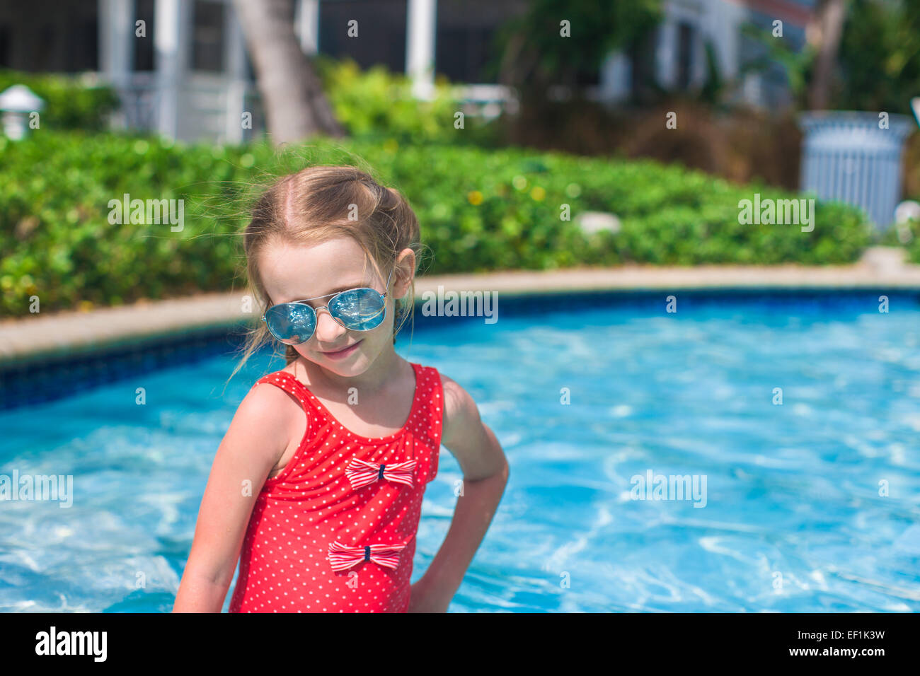 Little cute happy girl swims in the swimming pool Stock Photo Alamy
