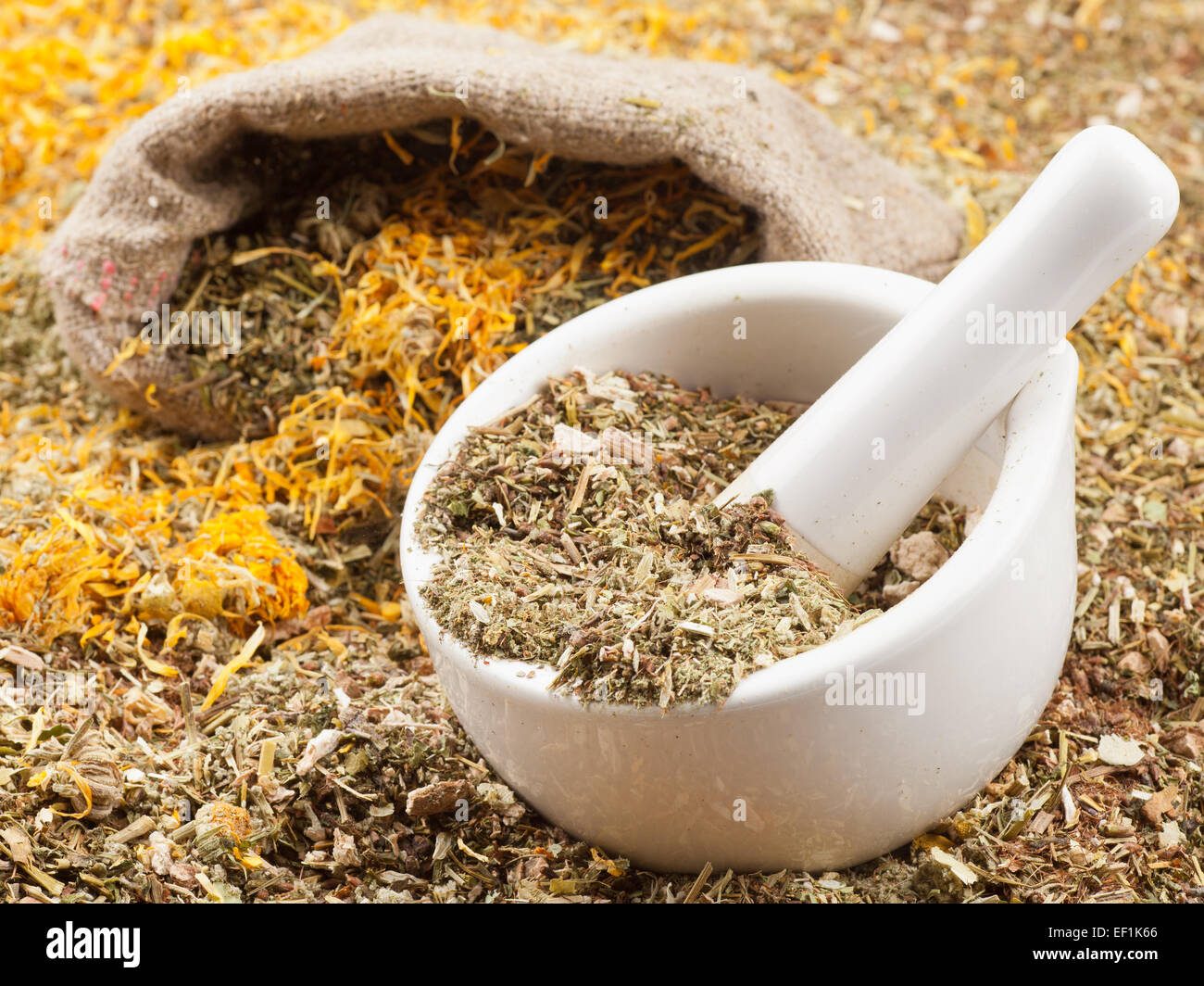 mortar, pestle and bag of healing herbs, herbal medicine Stock Photo
