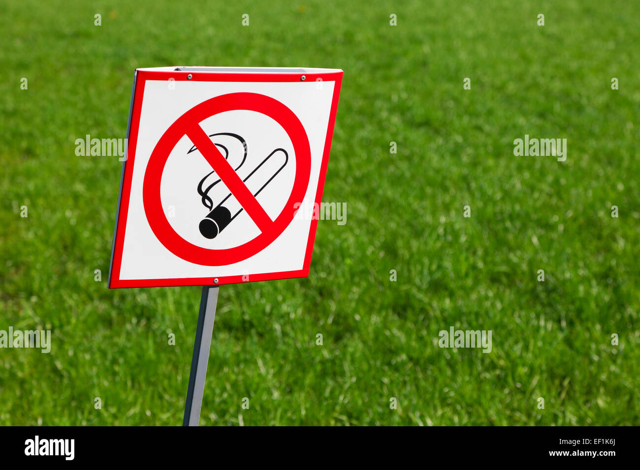 No smoking sign on green grass background Stock Photo