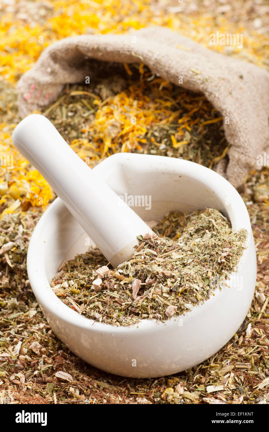 mortar, pestle and sack of healing herbs, herbal medicine Stock Photo Alamy