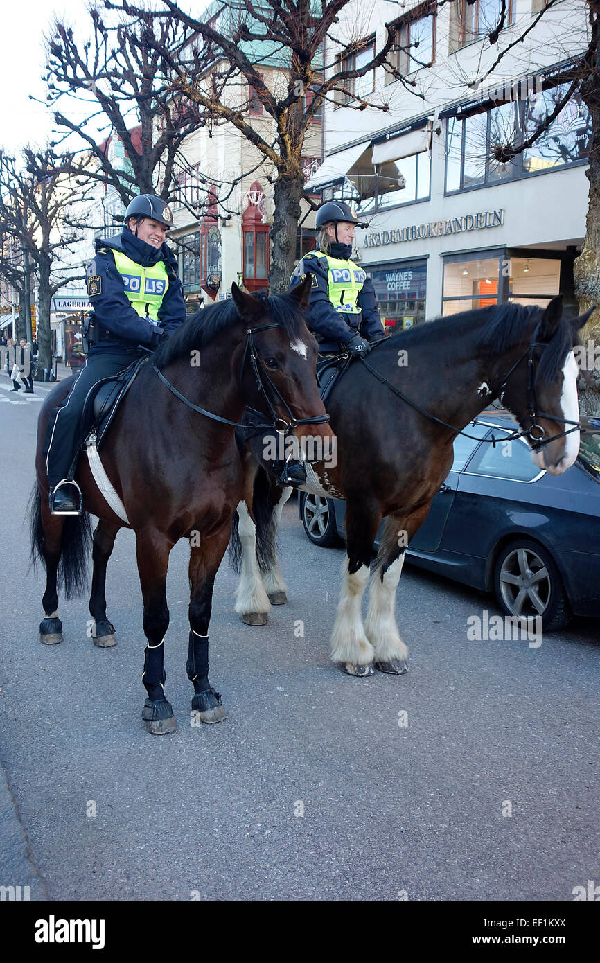 Swedish mounted female police officers patrol the street in Göteborg, Sweden Stock Photo