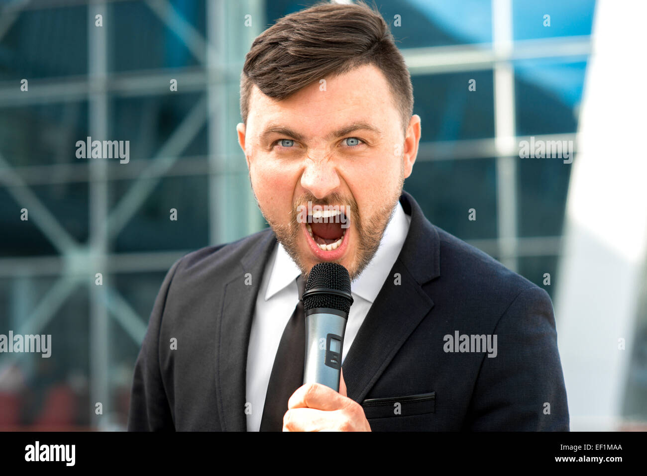 Toastmaster Microphone Male interviewer microphone hi-res stock photography and images - Alamy