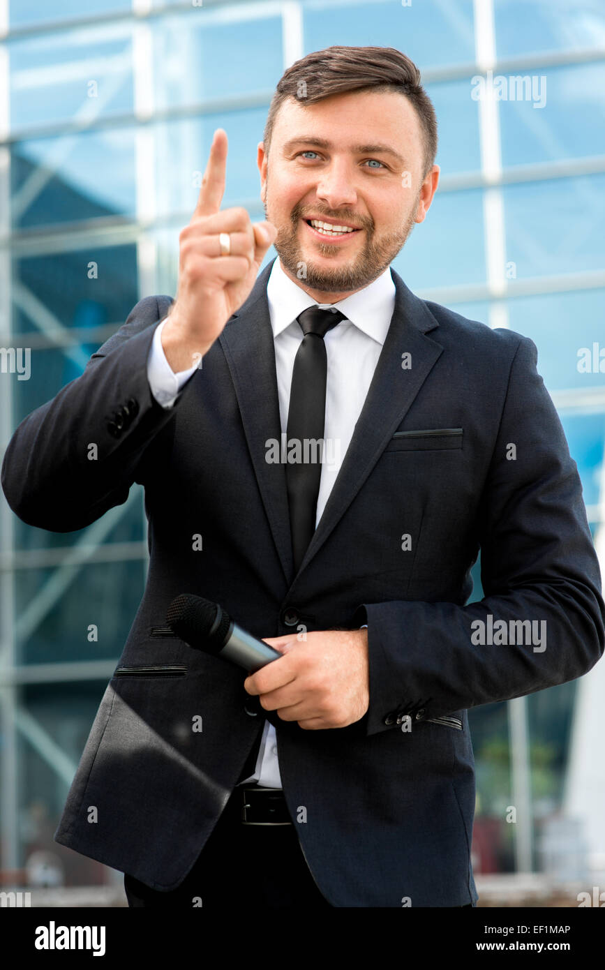 Toastmaster Microphone Toastmaster or newsmaker posing with microphone on the contempopary ...
