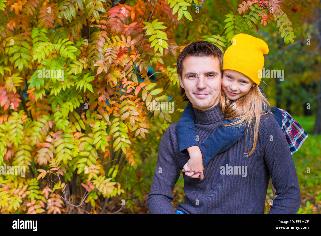 Father with cute daughter in autumn park outdoors Stock Photo - Alamy