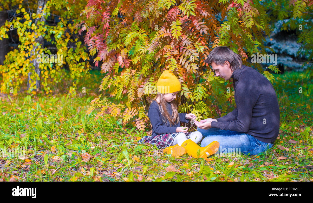 Father with cute daughter in autumn park outdoors Stock Photo - Alamy