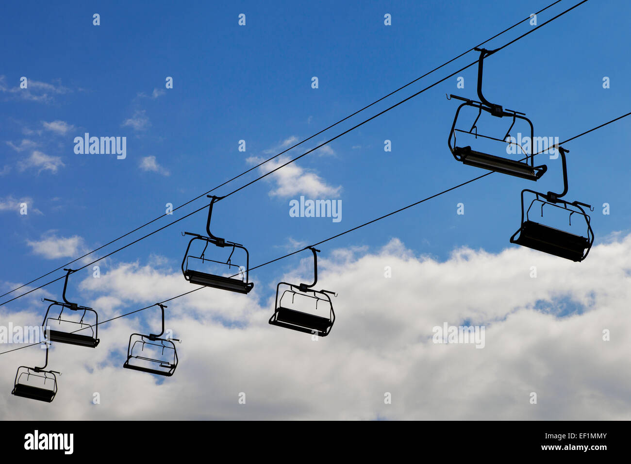 chair lift, cableway on blue sky background Stock Photo