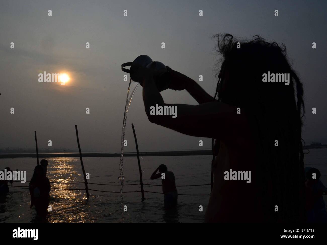 Allahabad: A Naga Sahu offer prayer to sun during sunrise after taking holydip in water of Sangam on the occasion of 'Basant Panchami' during one month long Magh mela festival in allahabad on 24-01-2015. photo by prabhat kumar verma A Sadhu offers prayer after a holy dip in the waters of Sangam during the ' Basant Panchami', festival that highlights the coming of spring. © Prabhat Kumar Verma/Pacific Press/Alamy Live News Stock Photo