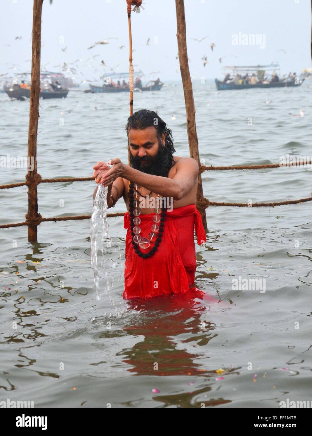 Allahabad: Shankaracharya Narendranand Saraswati offer prayer while taking holydip in water of Sangam on the occasion of 'Basant Panchami' during one month long Magh mela festival in allahabad on 24-01-2015. photo by prabhat kumar verma A Sadhu offers prayer after a holy dip in the waters of Sangam during the ' Basant Panchami', festival that highlights the coming of spring. © Prabhat Kumar Verma/Pacific Press/Alamy Live News Stock Photo