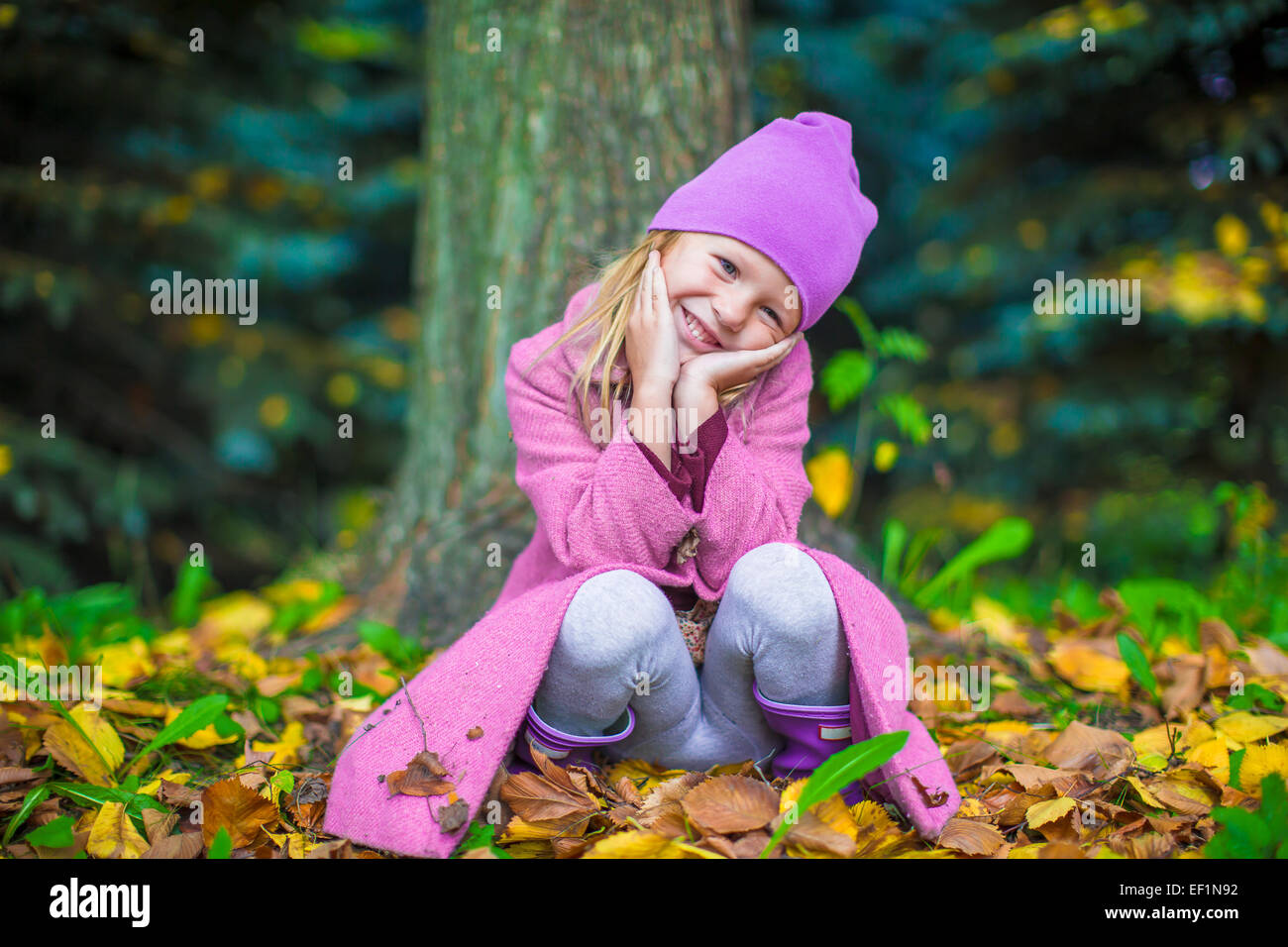 Little adorable girl in autumn park on sunny fall day Stock Photo - Alamy