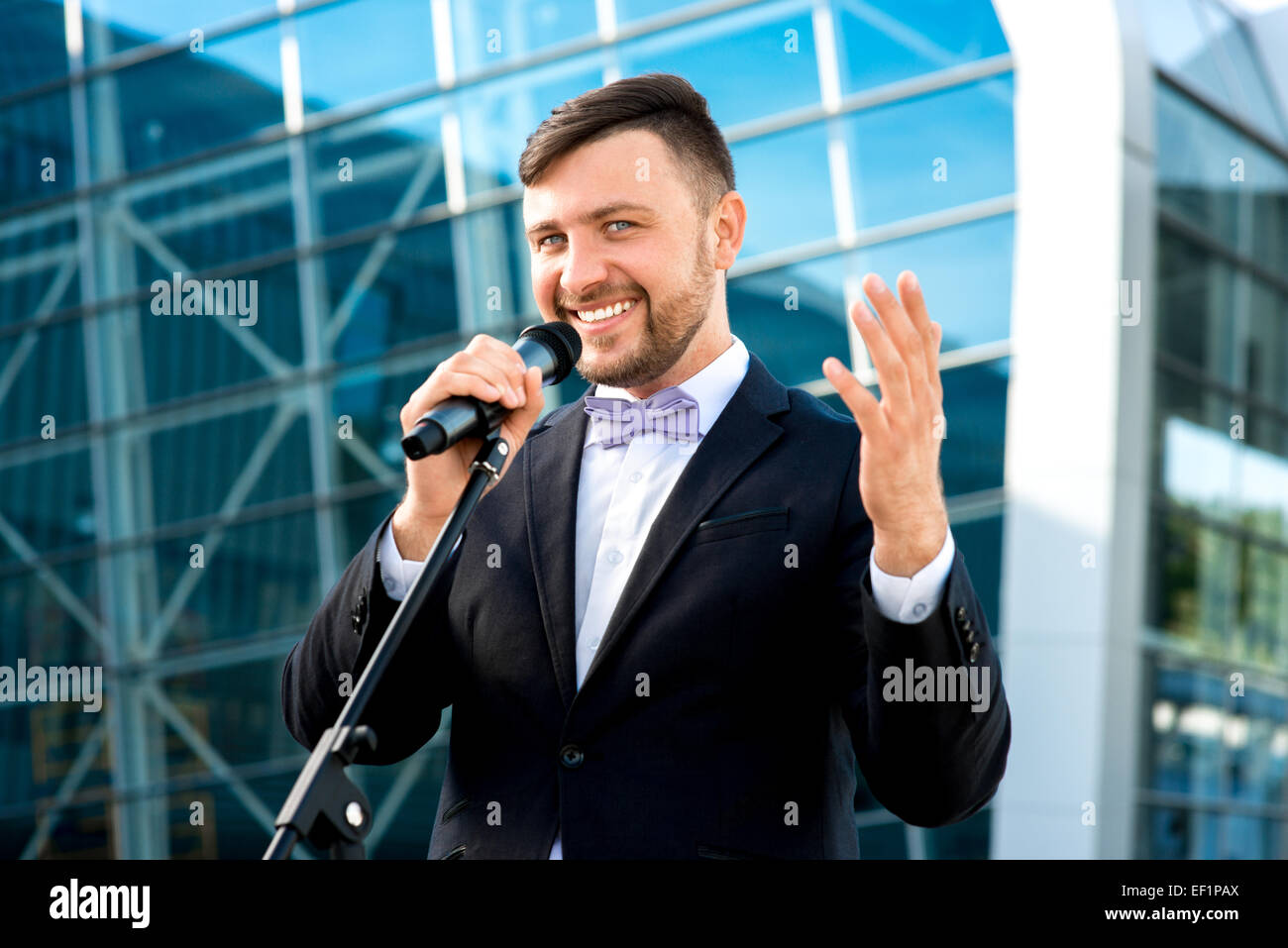 Toastmaster Microphone Toastmaster or newsmaker posing with microphone on the contempopary ...