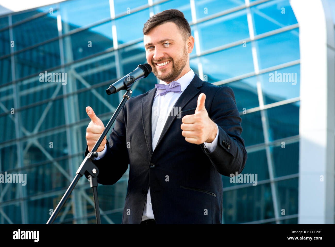 Toastmaster Microphone Toastmaster or newsmaker posing with microphone on the contempopary ...