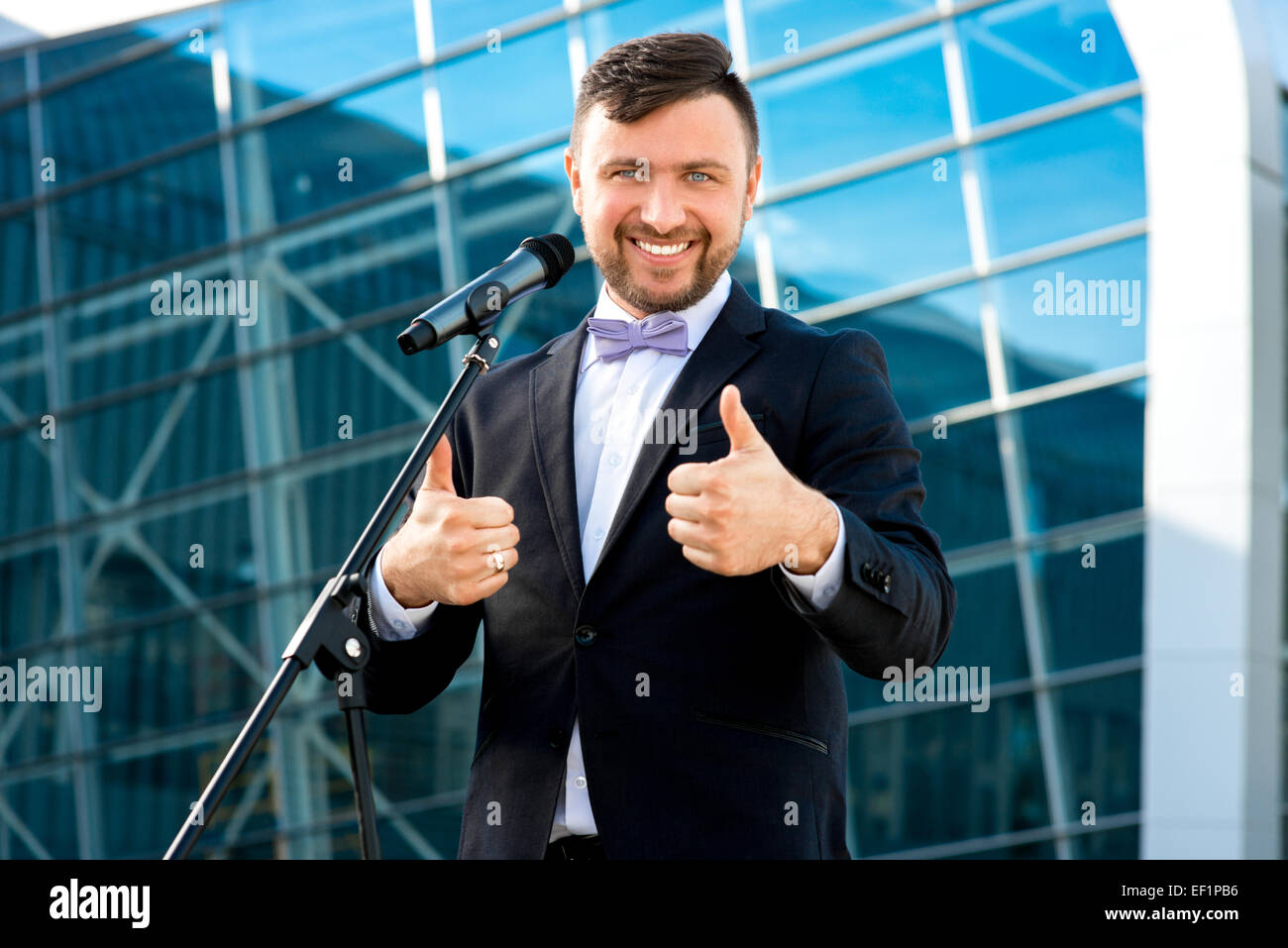 Toastmaster Microphone Toastmaster or newsmaker posing with microphone on the contempopary ...