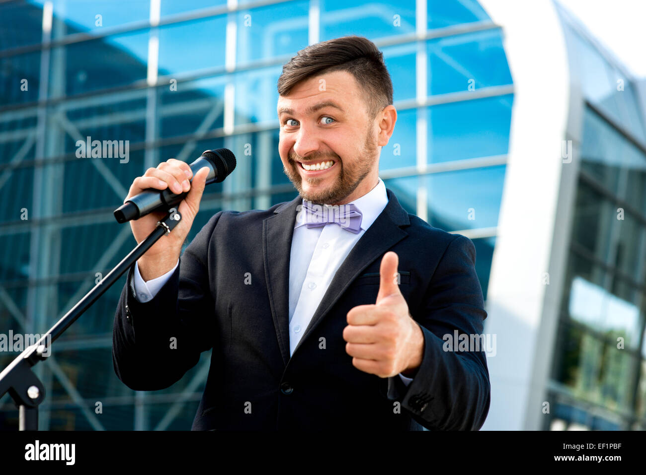 Toastmaster Microphone Toastmaster or newsmaker posing with microphone on the contempopary ...