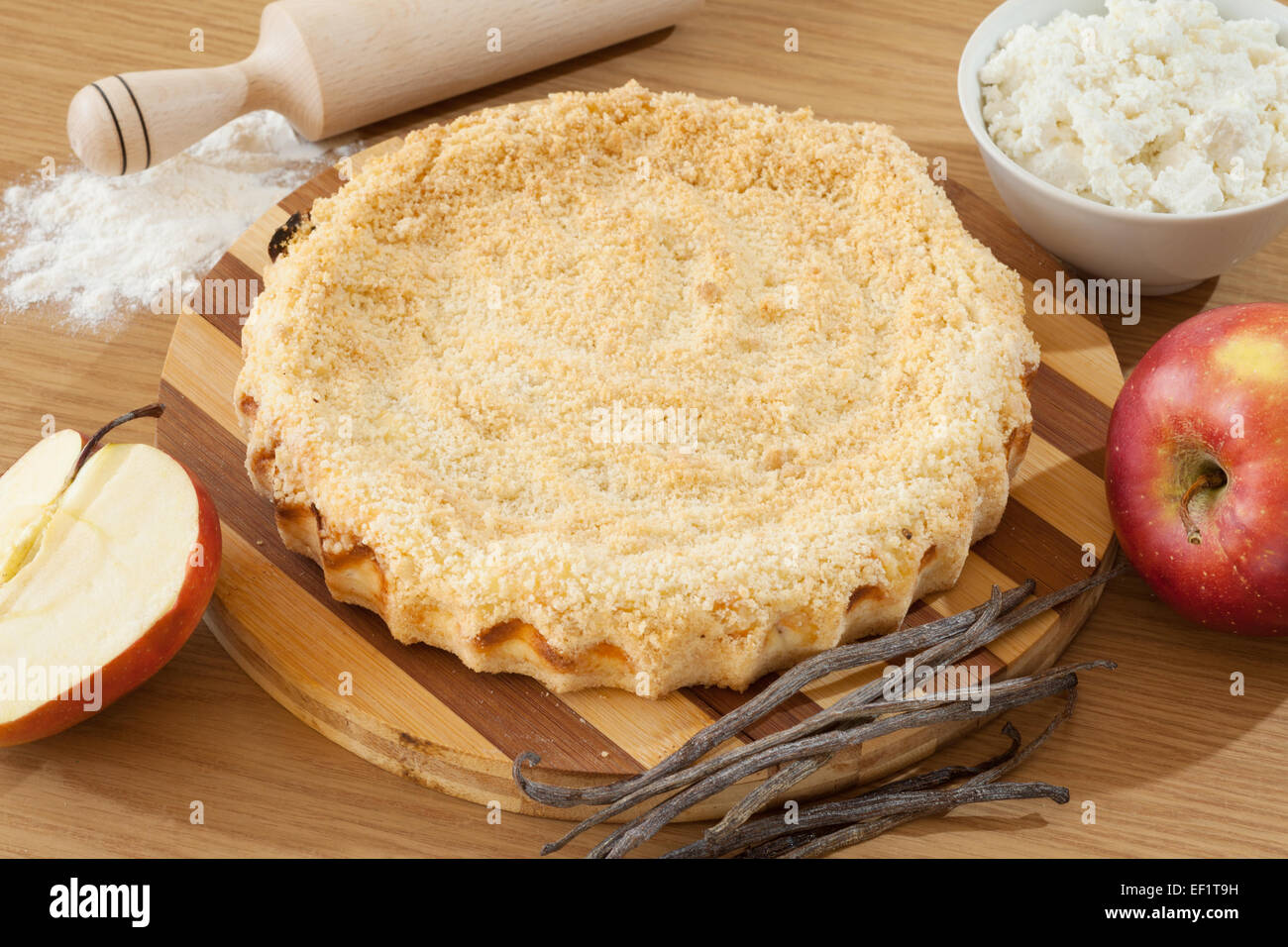 homemade cheesecake with apple on kitchen table Stock Photo