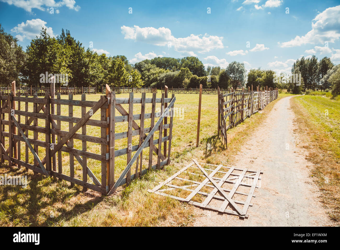 wooden rustic fence and village landscape Stock Photo