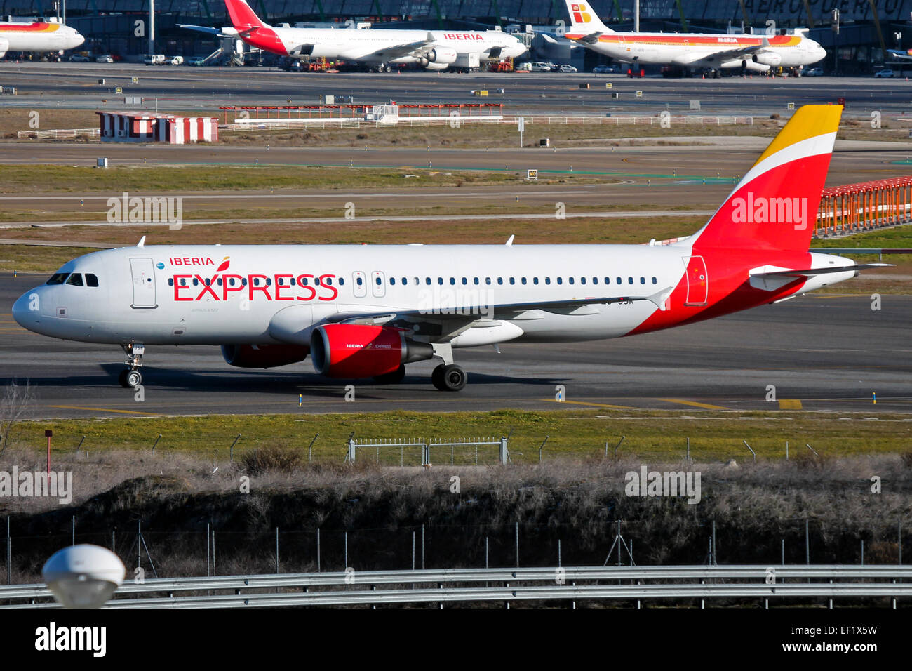Iberia Express Airbus A320 taxis to stand at Madrid airport. Stock Photo