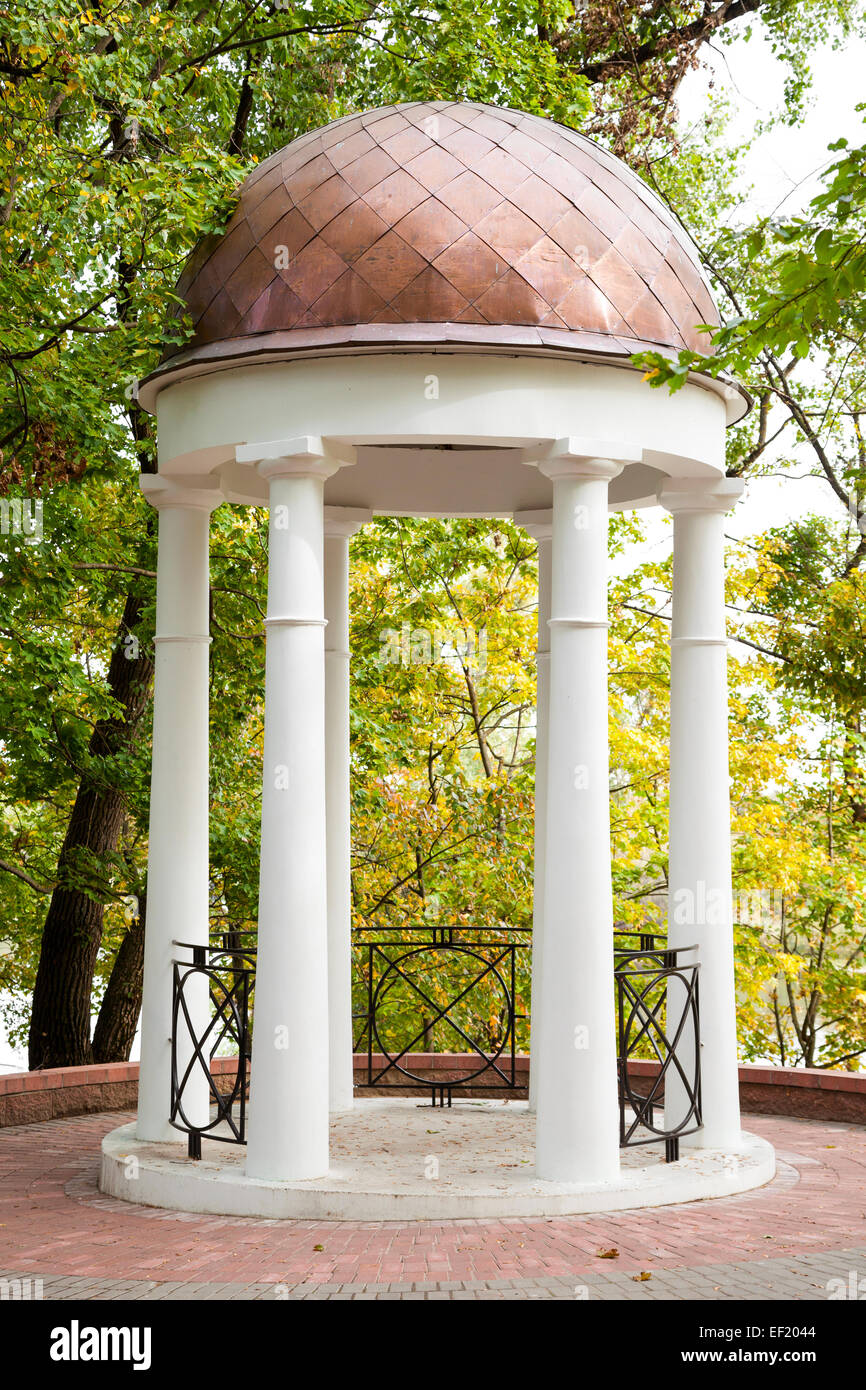 Gazebo with columns in autumn garden, classic style Stock Photo