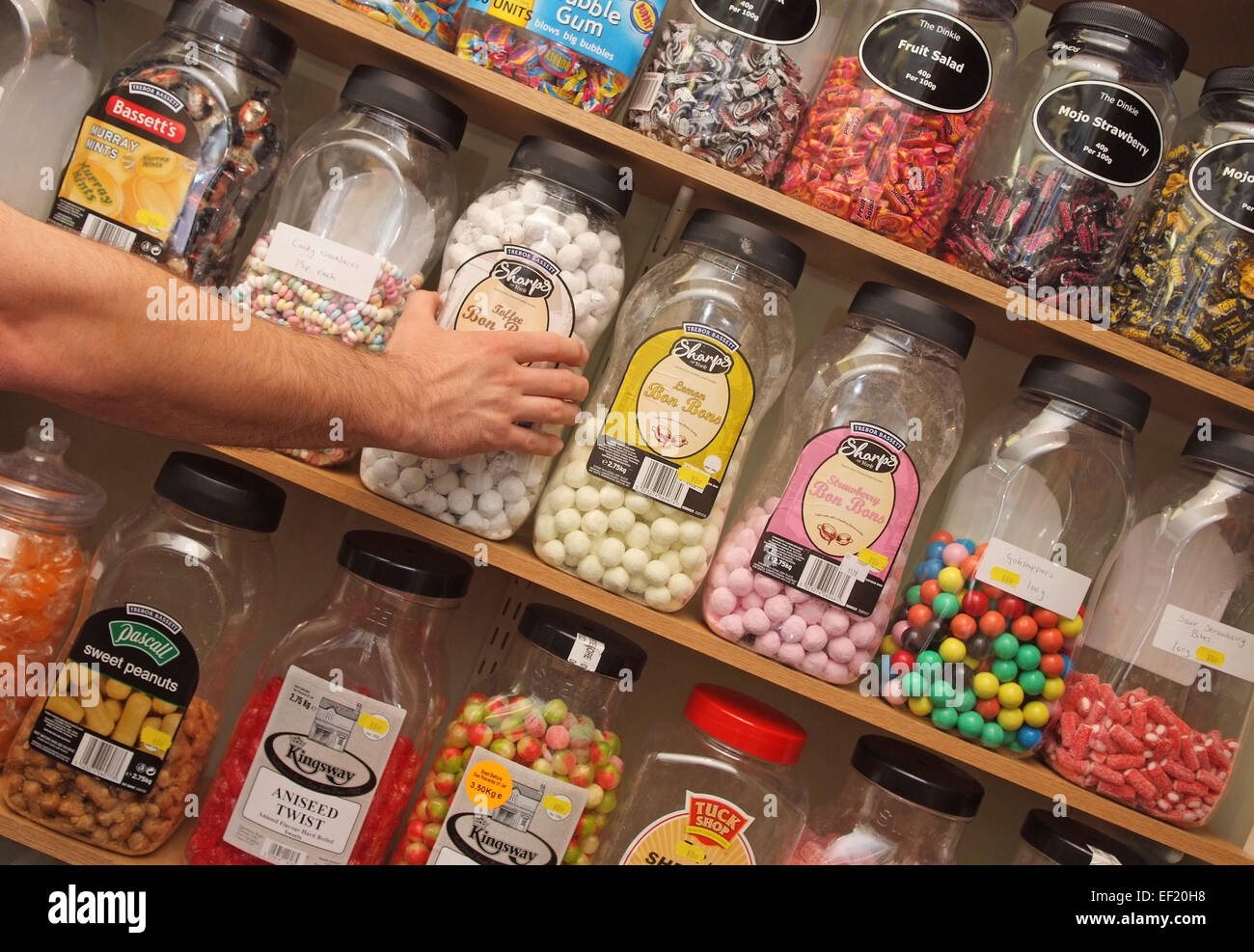Traditional sweetshop selling in jars,including gobstoppers,toffees,humbugs,and boiled sweets.a UK inflation confectionery child Stock Photo