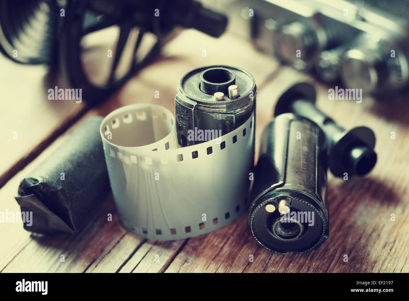 Old photo film rolls, cassette and retro camera. Vintage stylized. Stock Photo