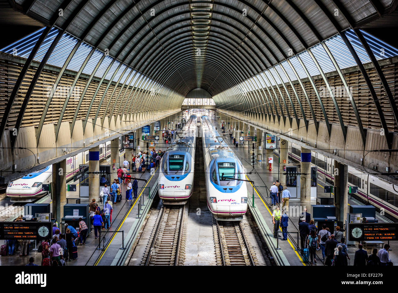 Passengers and trains at Santa Justa Station in Seville, Spain. Stock Photo