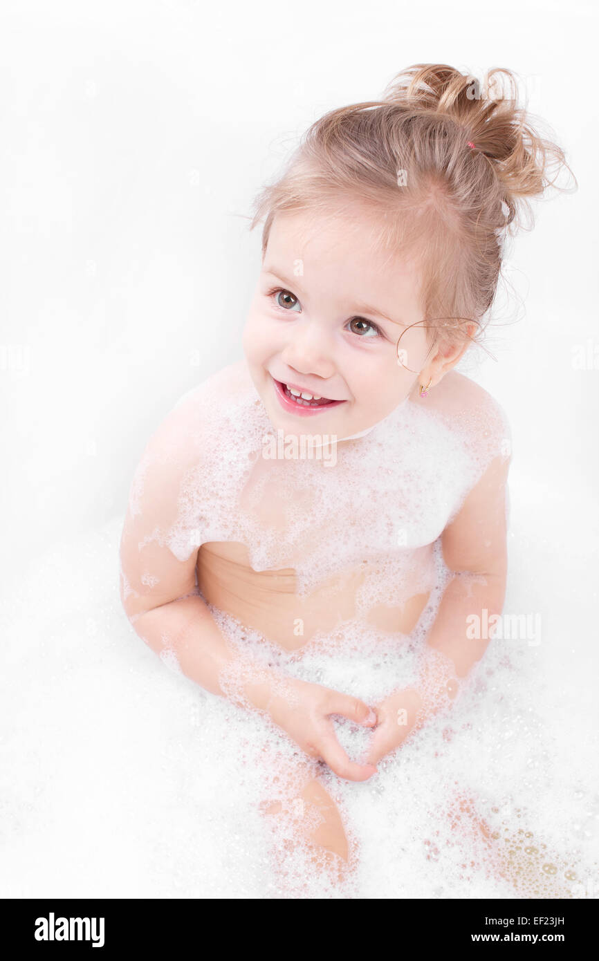 Smiling at the bath little girl Stock Photo