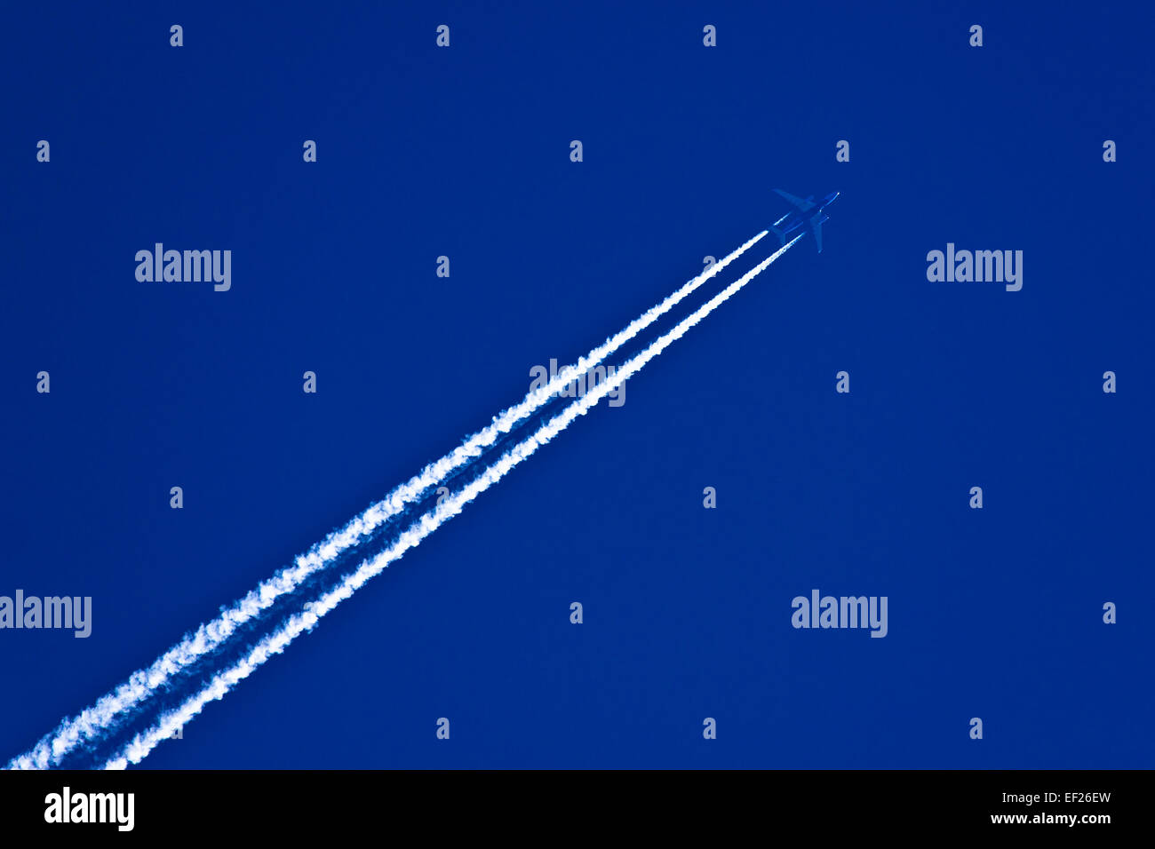 An airplane in the sky Stock Photo - Alamy