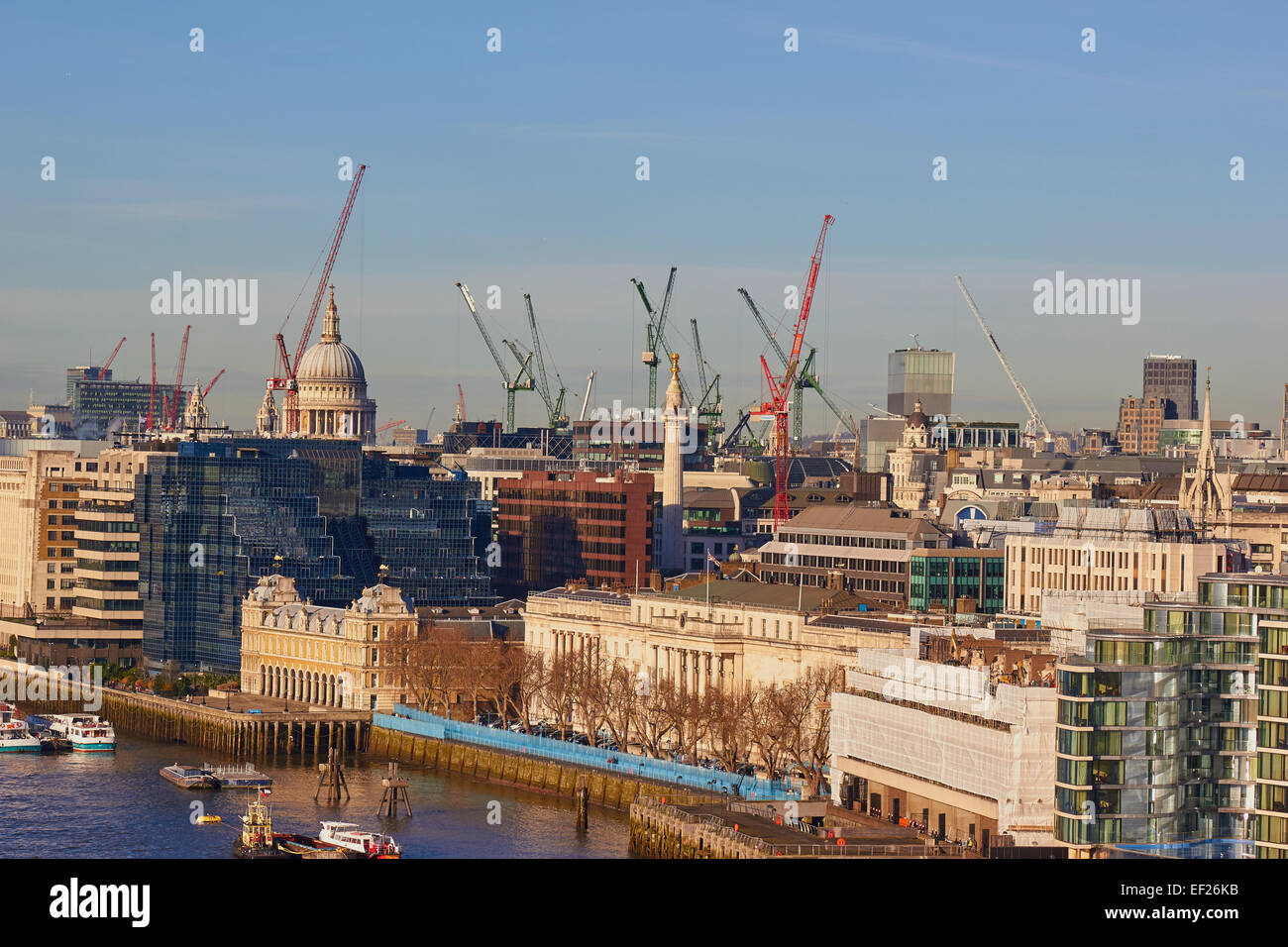 City of London skyline dotted with cranes and the dome of St Paul's Cathedral London England Europe Stock Photo